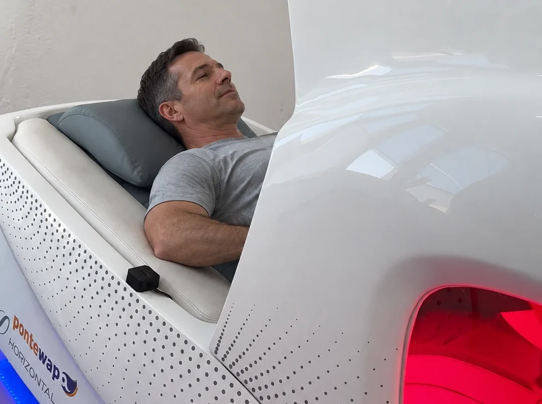 Man resting in a supported infrared bike — AI illustration